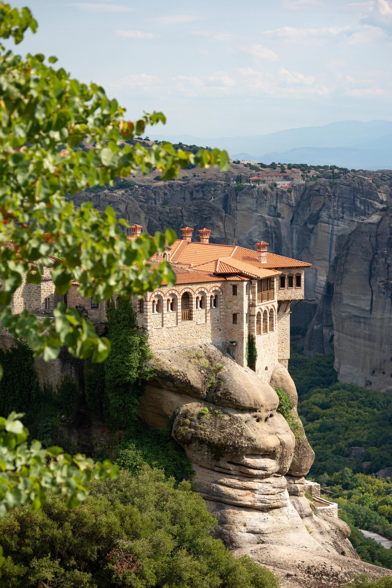 View of Moni Varlaam (Varlaam Monastery) perched on a rock in Meteora, Greece.