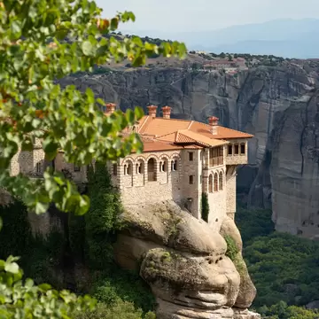 View of Moni Varlaam (Varlaam Monastery) perched on a rock in Meteora, Greece.