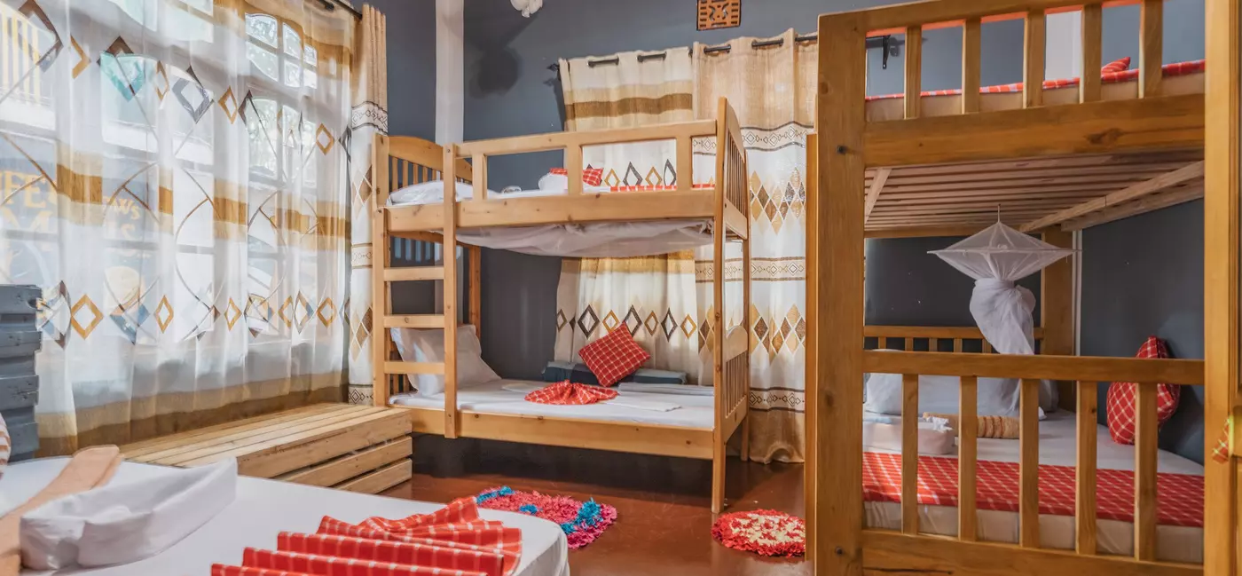 A tidy dorm room with bunk beds.