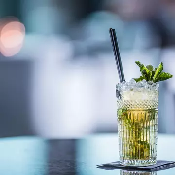 Mojito summer cocktail on a table at a restaurant.