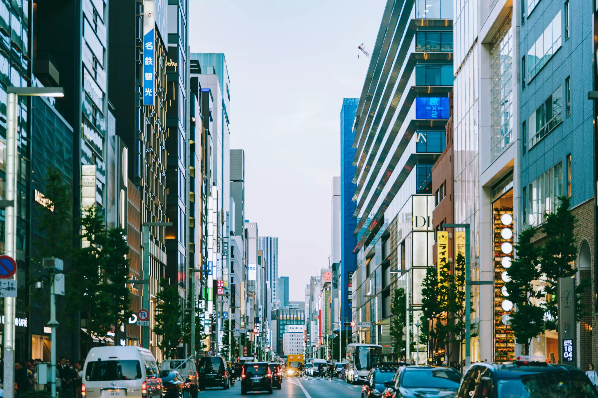 A road with skyscrapers on either side.