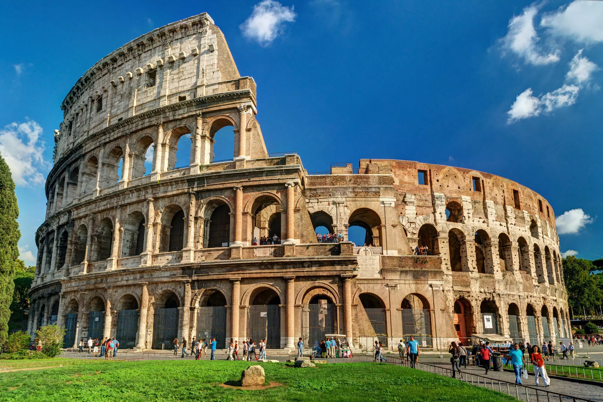 Tourists visiting the Colosseum in the October sunshine. Viacheslav Lopatin/Shutterstock
