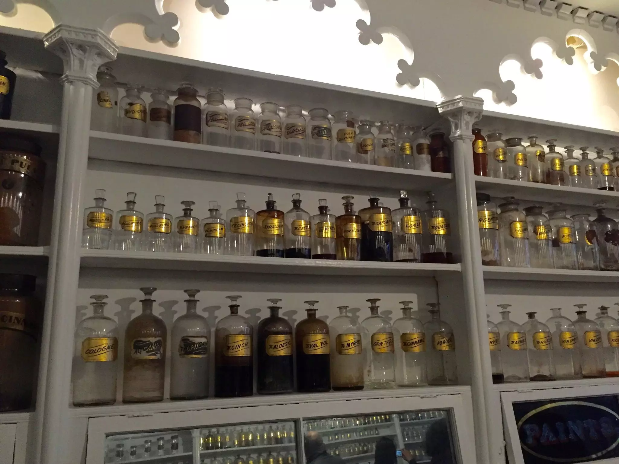 Apothecary shelves with glass bottles at Stabler-Leadbeater Apothecary Museum.