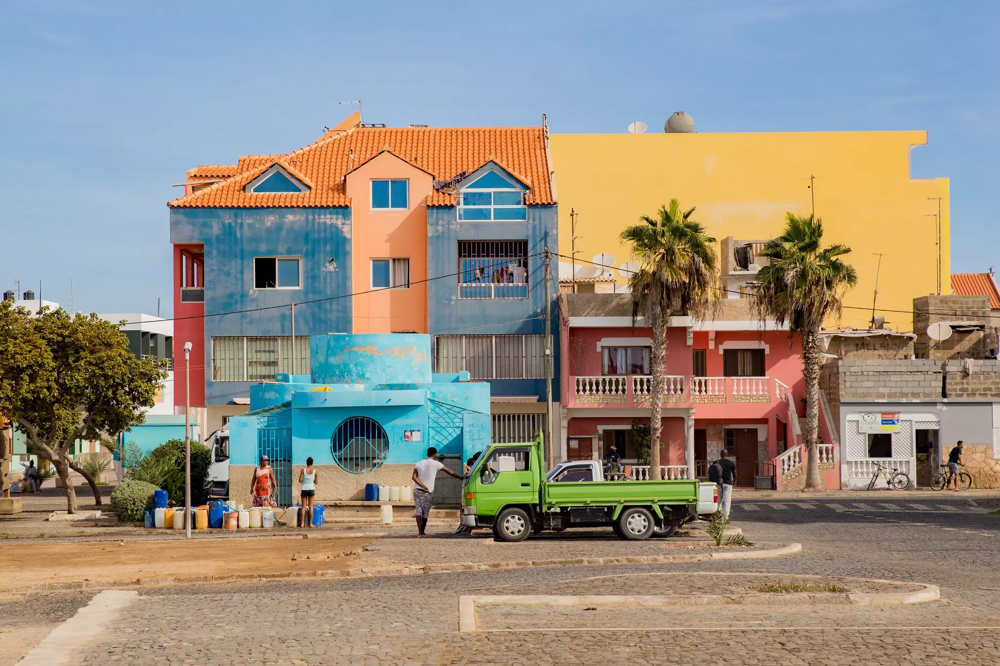 Pastel-colored buildings in a town center.