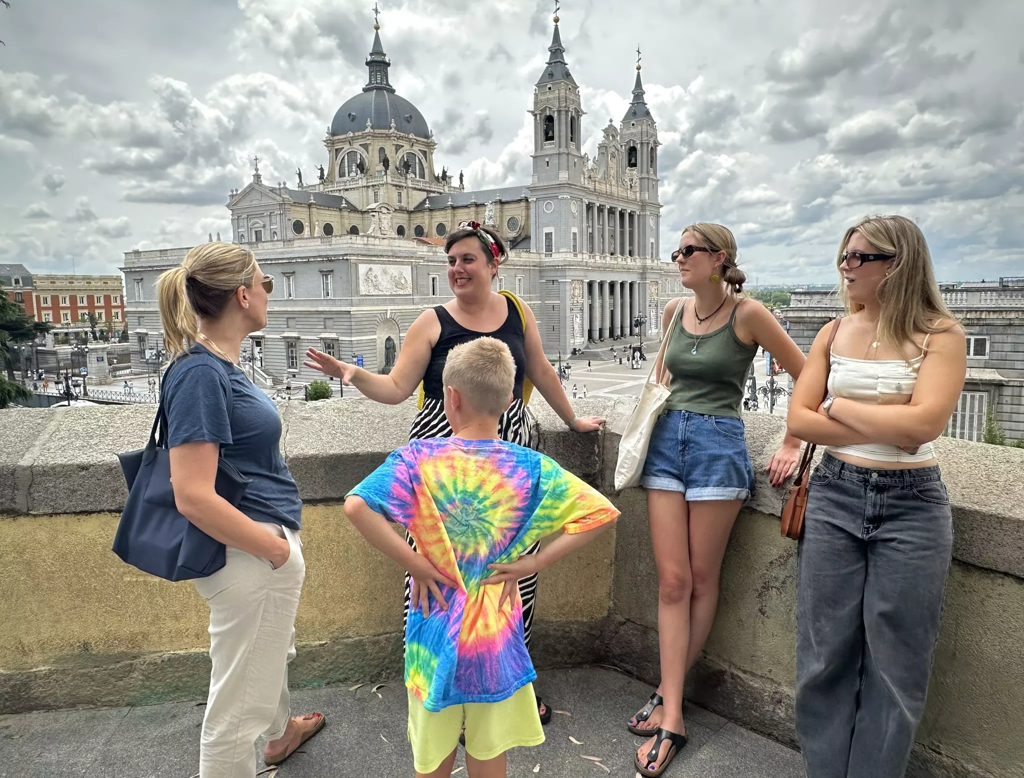 A mother and her three children listen to a tour guide in Madrid. IMG0750.jpeg