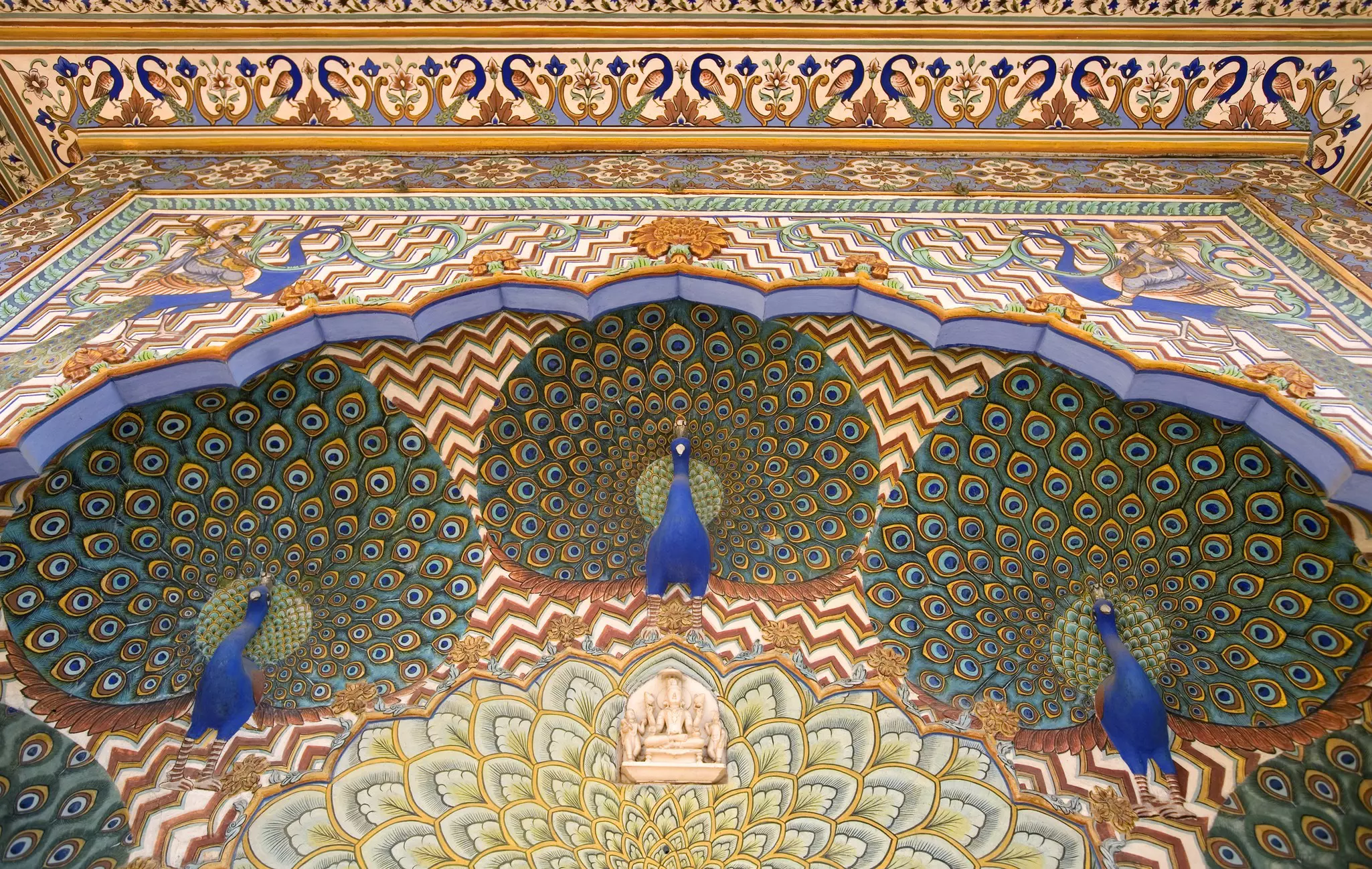 Murals on the famous Peacock Gate inside the City Palace, Jaipur, Rajasthan, India.