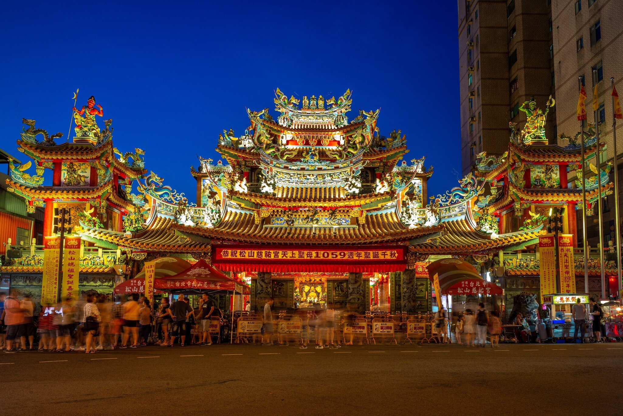 Front of Ciyou Temple lit up at night in Taipei.