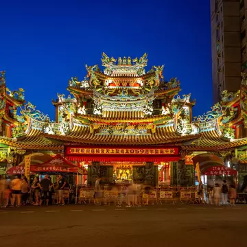 Front of Ciyou Temple lit up at night in Taipei.
