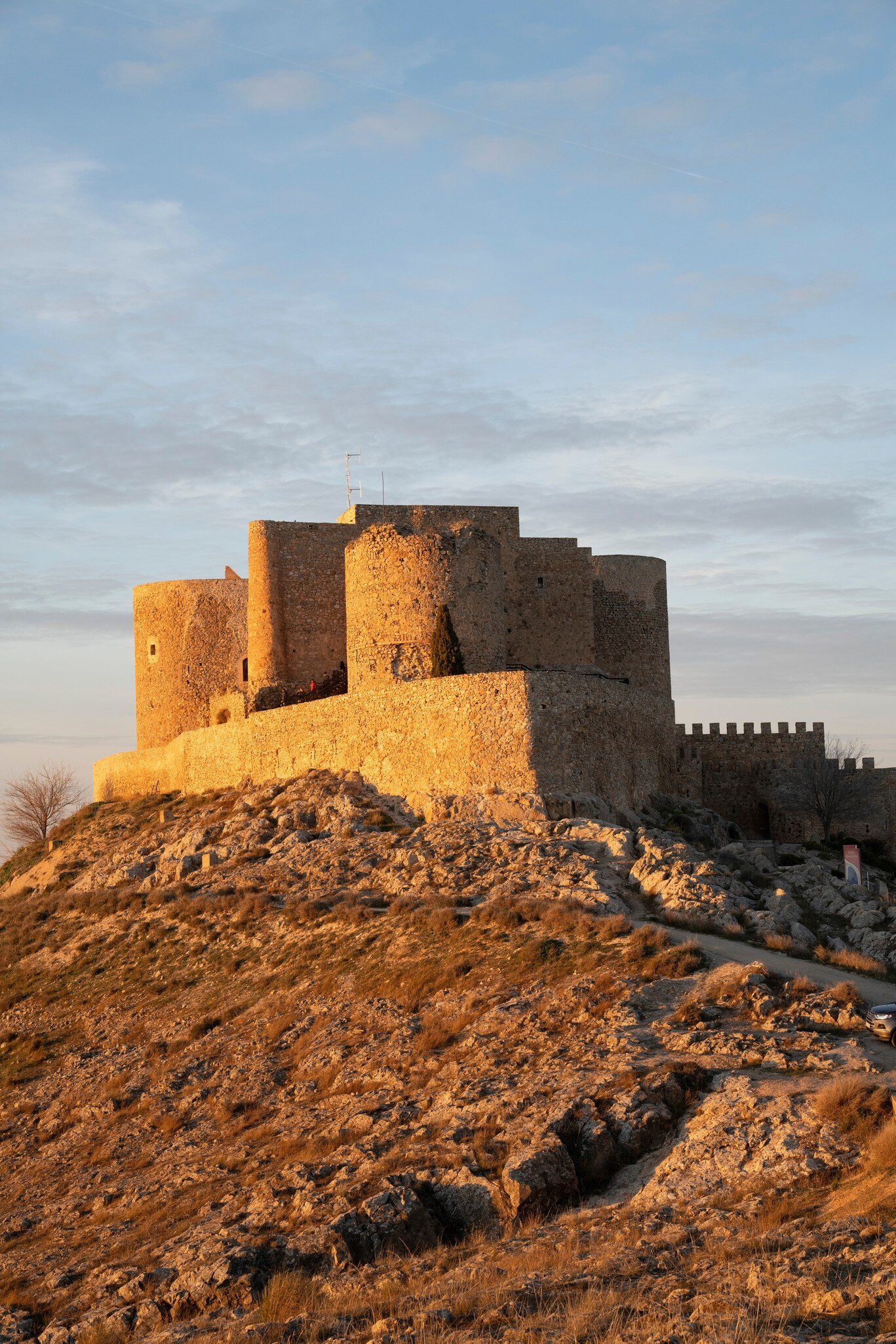 View of the Castillo de Consuegra at sunset in Spain.