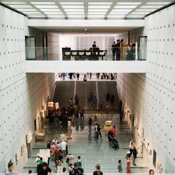 People walking in a brightly lit museum