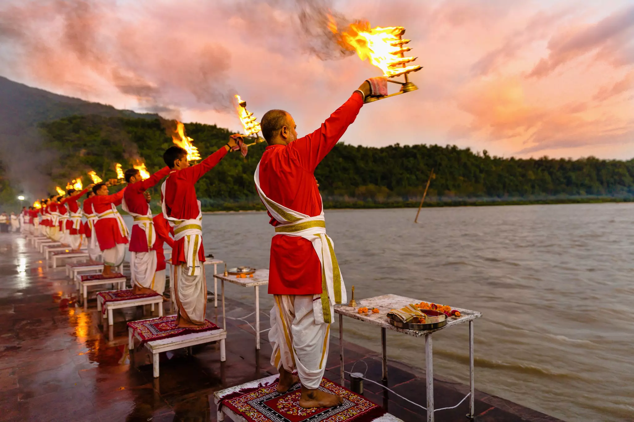 Priests raise lamps as part of the Ganga Aarti ceremony on the banks of the River Ganges in Rishikesh, Uttarakhand, India.