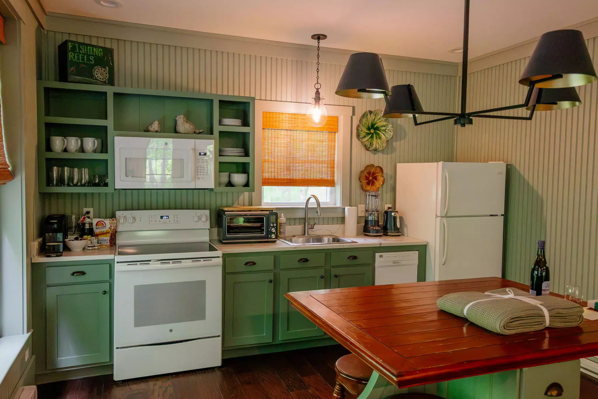 Kitchen, shower and porch at Fawn's Pass cottage, Hidden Pond, Maine