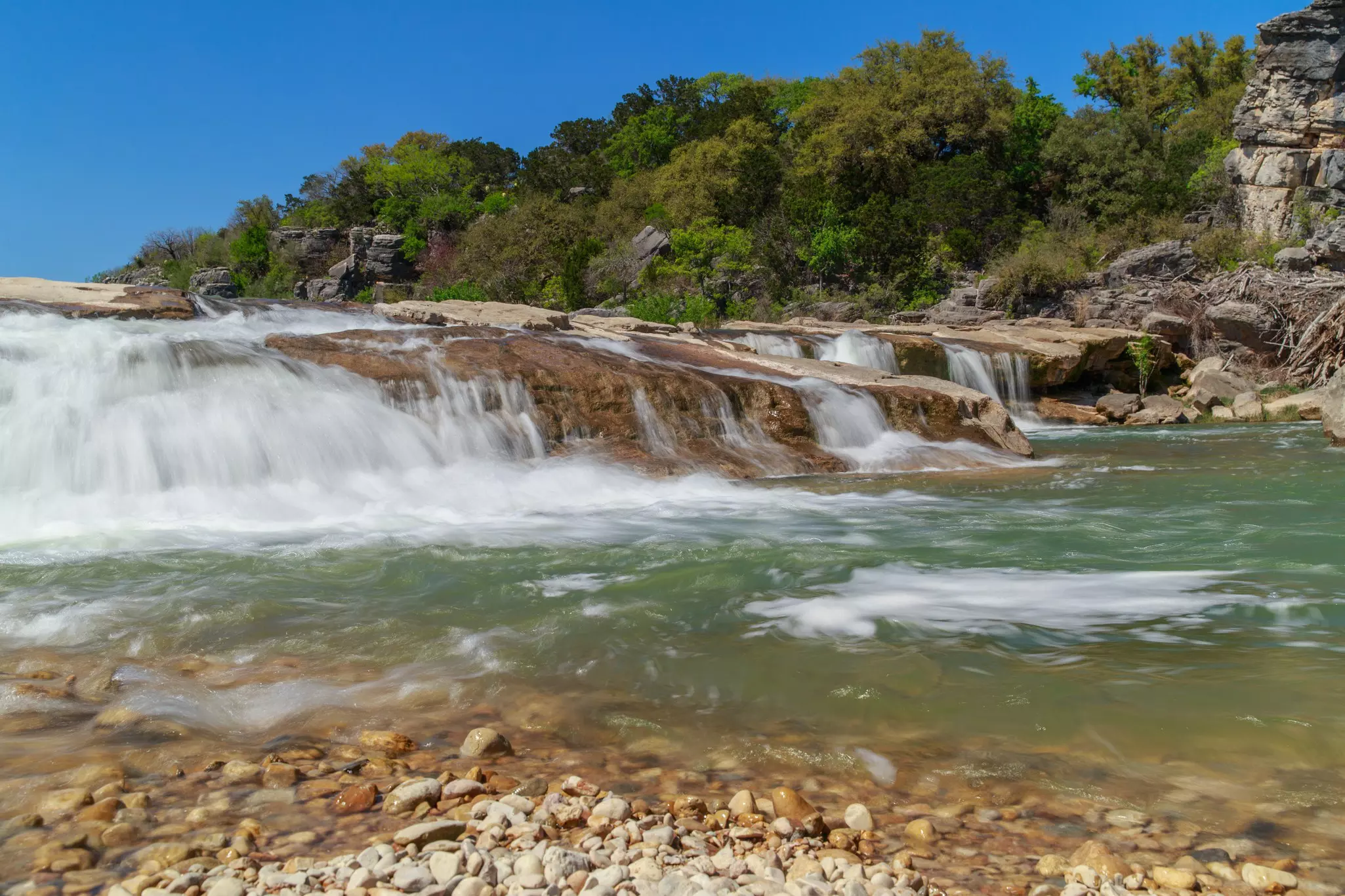 The waters flowing over the falls at Pedernales State Park, Texas
