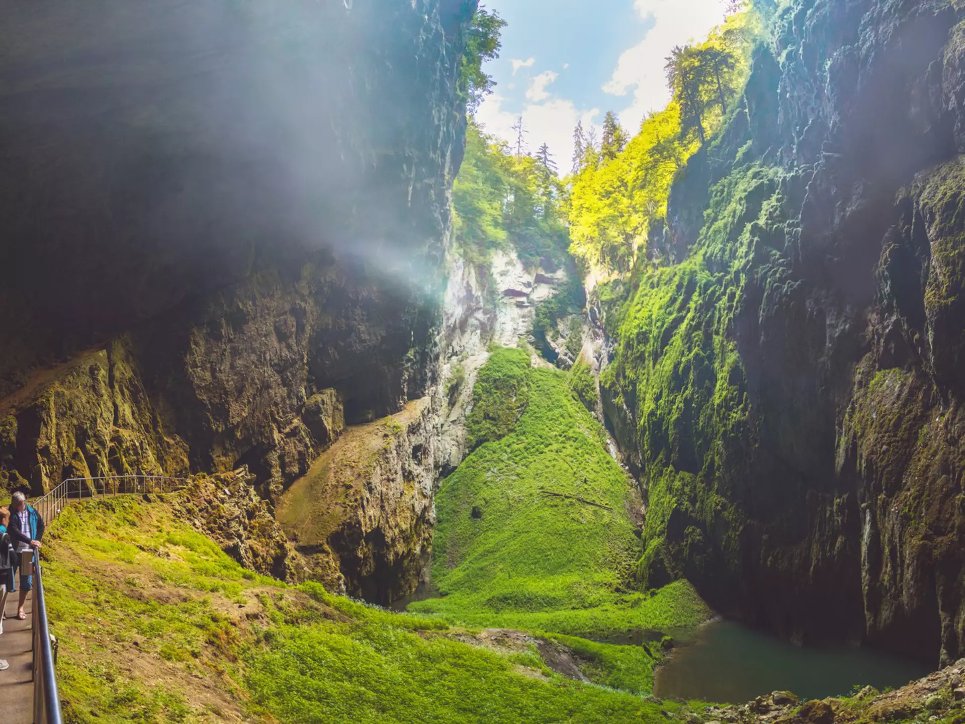 Macocha/Czech republic 07 02 2019: Macocha Gorge - The Macocha Abyss (Propast Macocha). Sinkhole in the Moravian Karst Punkva caves system of the Czech Republic. People at the bottom of the abyss.  License Type: media  Download Time: 2023-08-07T05:22:53.000Z  User: hannahblackie10  Is Editorial: Yes  purchase_order: