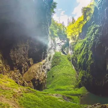 Macocha/Czech republic 07 02 2019: Macocha Gorge - The Macocha Abyss (Propast Macocha). Sinkhole in the Moravian Karst Punkva caves system of the Czech Republic. People at the bottom of the abyss.  License Type: media  Download Time: 2023-08-07T05:22:53.000Z  User: hannahblackie10  Is Editorial: Yes  purchase_order: