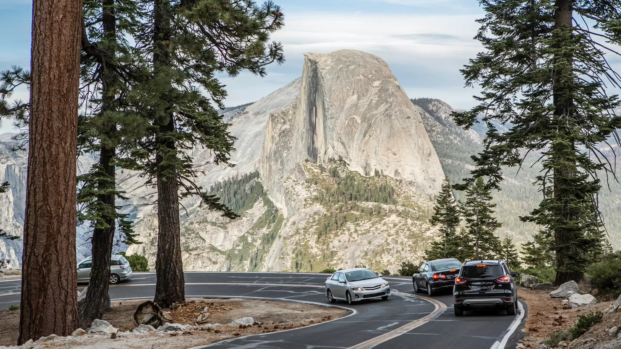 A road with a view of Half Dome, Yosemite National Park, California. Jordan Siemens/Getty Images