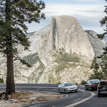 A road with a view of Half Dome, Yosemite National Park, California. Jordan Siemens/Getty Images