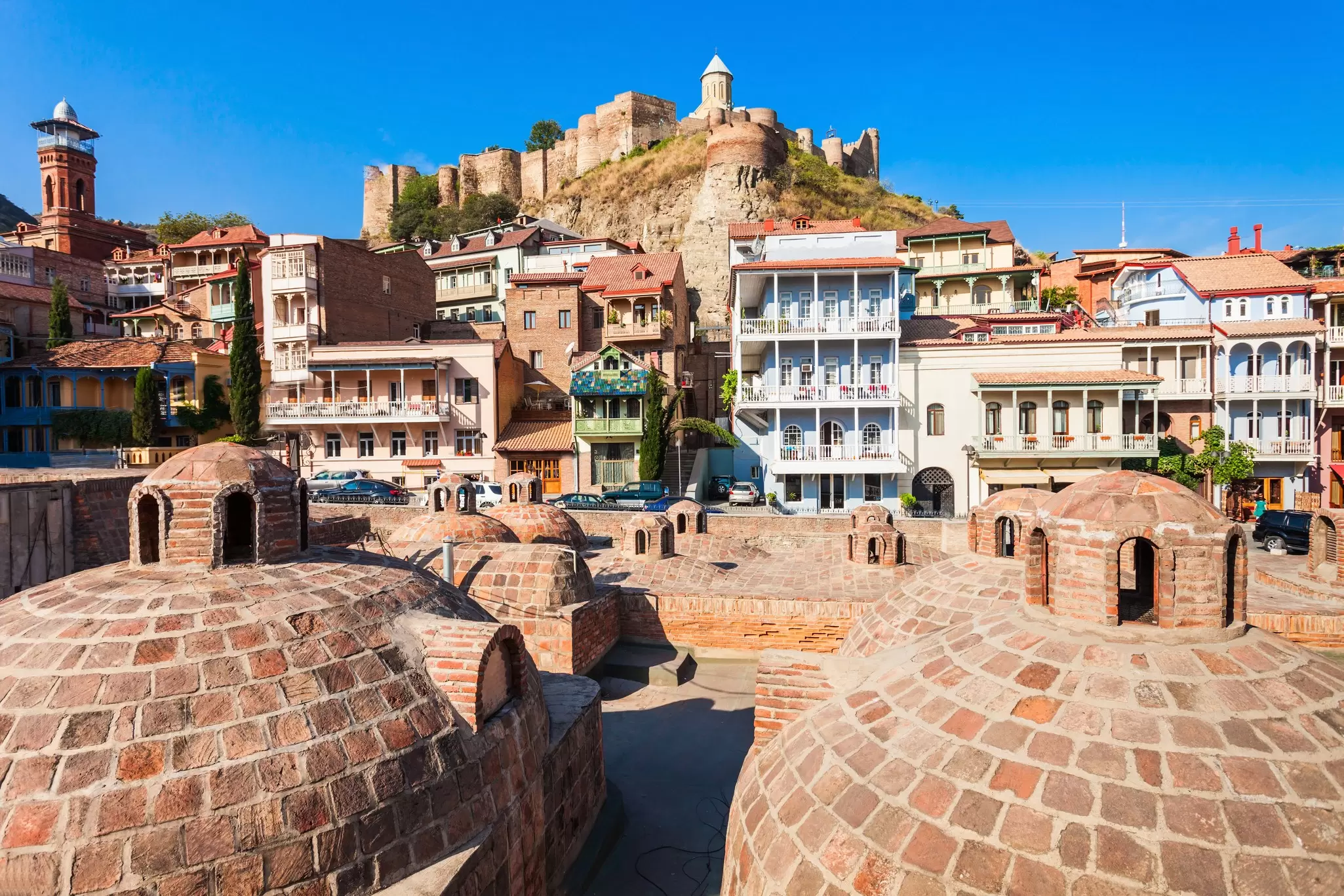 Tbilisi's Old Town is famous for its domed abanotubani (sulphur baths) and colourful houses with wooden balconies. saiko3p / Getty Images