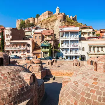 Tbilisi's Old Town is famous for its domed abanotubani (sulphur baths) and colourful houses with wooden balconies. saiko3p / Getty Images