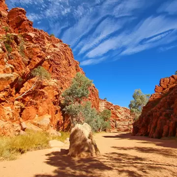 Ground view of Emily Gap with bright blue sky, MacDonnell Ranges, Australia.