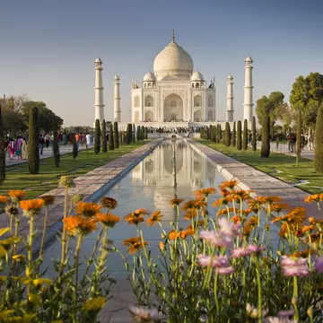Taj Mahal with flowers in the foreground.
629824608
Architecture, Mausoleum, Agra, Photography, Full Length, UNESCO World Heritage Site, Travel Destinations, Horizontal, Color Image, People, White Color, Springtime, Taj Mahal, India, Flower, Reflection, Large Group Of People