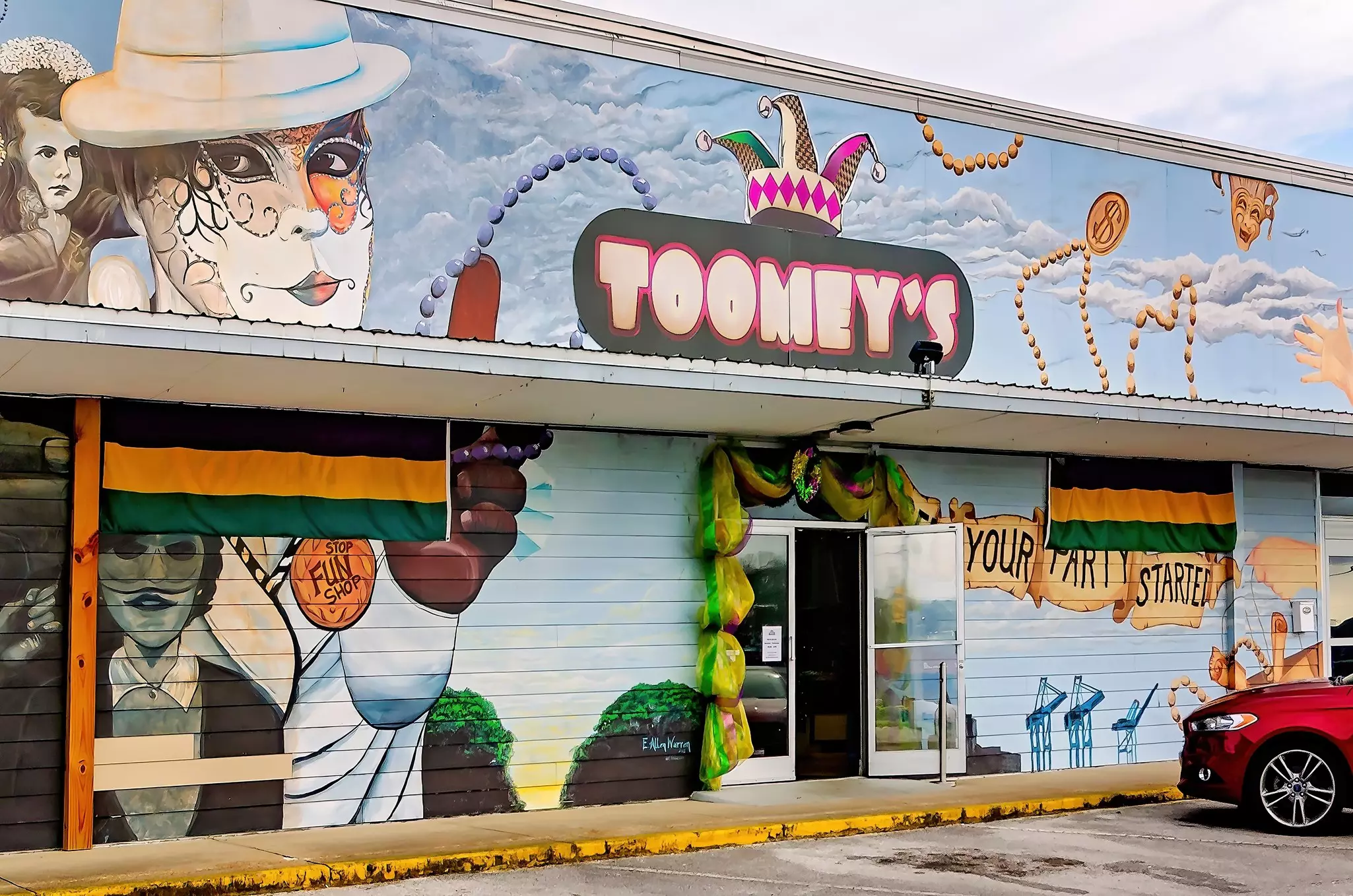 MoToomey’s Mardi Gras shop is adorned with Mardi Gras murals in Mobile, Alabama. Toomey’s opened its Mardi Gras warehouse in 1978.
