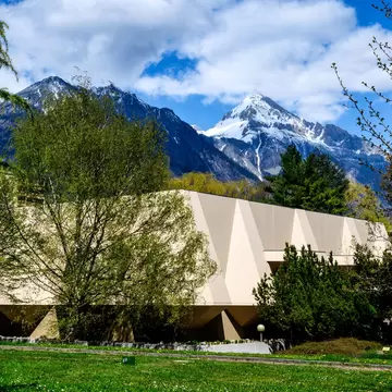 MartignySwitzerland, April 13 2021, outside view of the Pierre Gianadda Foundation on a backdrop of mountains and blue sky; Shutterstock ID 1959862153;