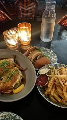 A burger, fries and chicken from the Columns. 