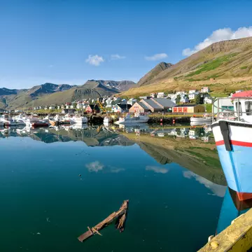Boats docked along a beautiful port in Siglufjörður, Iceland