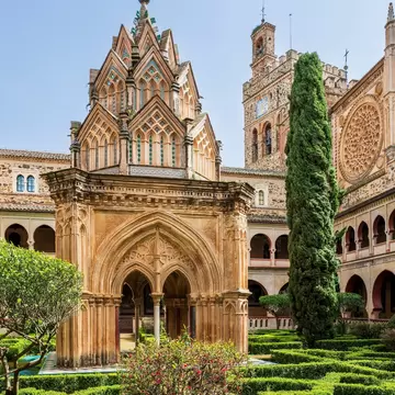 View of the inner courtyard and cloisters of the Real Monasterio de Santa María de Guadalupe in Spain.