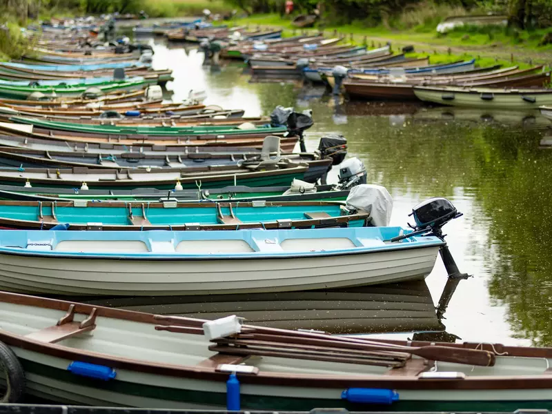 Colorful boats docked by a shore.