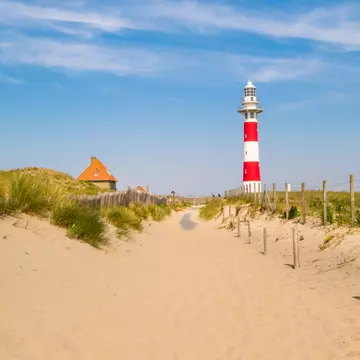 Lighthouse on the coast of the North Sea in a sunny day, Belgium