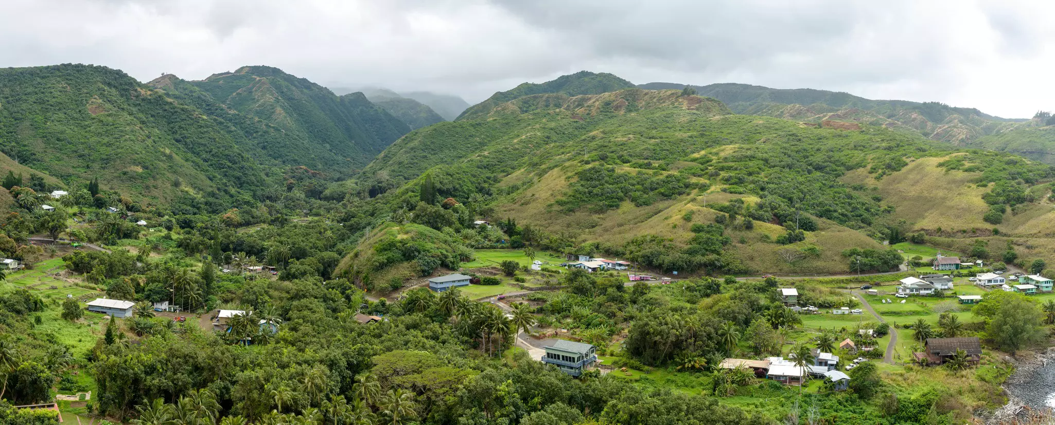 Evening view of a local village on Kahekili Highway at the northeast shore of West Maui, Hawaii, USA