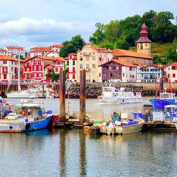 Traditional half-timbered basque houses in port of St Jean de Luz, on the atlantic coast of France