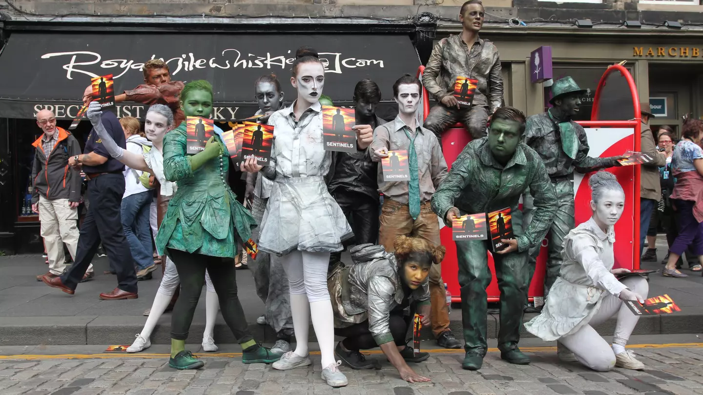 Members of Babolin Theatre publicize their show Sentinels during Edinburgh Fringe Festival on August 10, 2013 in Edinburgh, Scotland