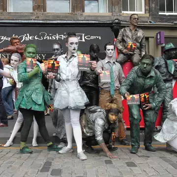 Members of Babolin Theatre publicize their show Sentinels during Edinburgh Fringe Festival on August 10, 2013 in Edinburgh, Scotland