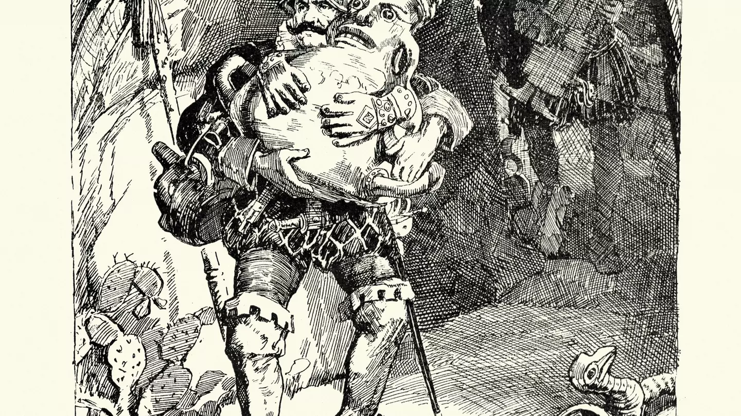 A sculpture of a black arm surrounded by flowers by Nick Cave