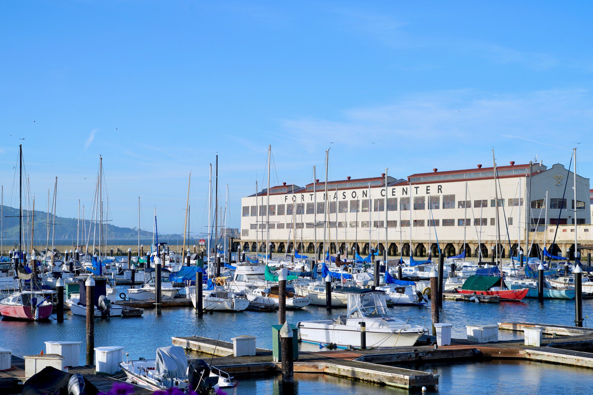San Francisco, CA / USA - April 13, 2019: view across sail boat berths to Fort Mason Center, former US Army post, now the location of arts organizations, event centers and restaurants  License Type: media  Download Time: 2023-05-20T06:36:25.000Z  User: claramonitto  Is Editorial: Yes  purchase_order:   