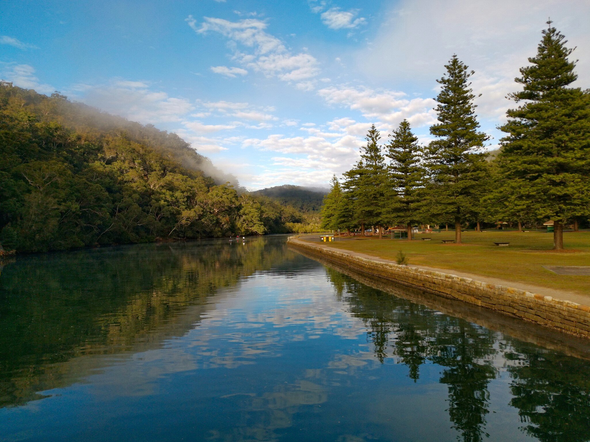 Early morning view of a river with eflections on water, Cockle creek, Bobbin Head, Ku-ring-gai Chase National Park, New South Wales, Australia.