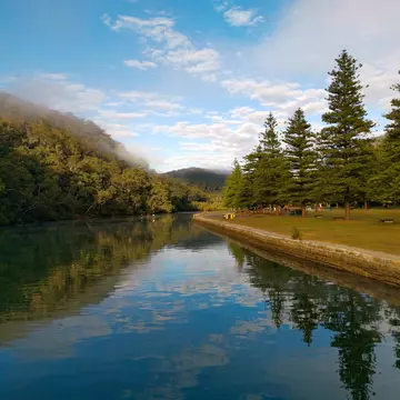 Early morning view of a river with eflections on water, Cockle creek, Bobbin Head, Ku-ring-gai Chase National Park, New South Wales, Australia.