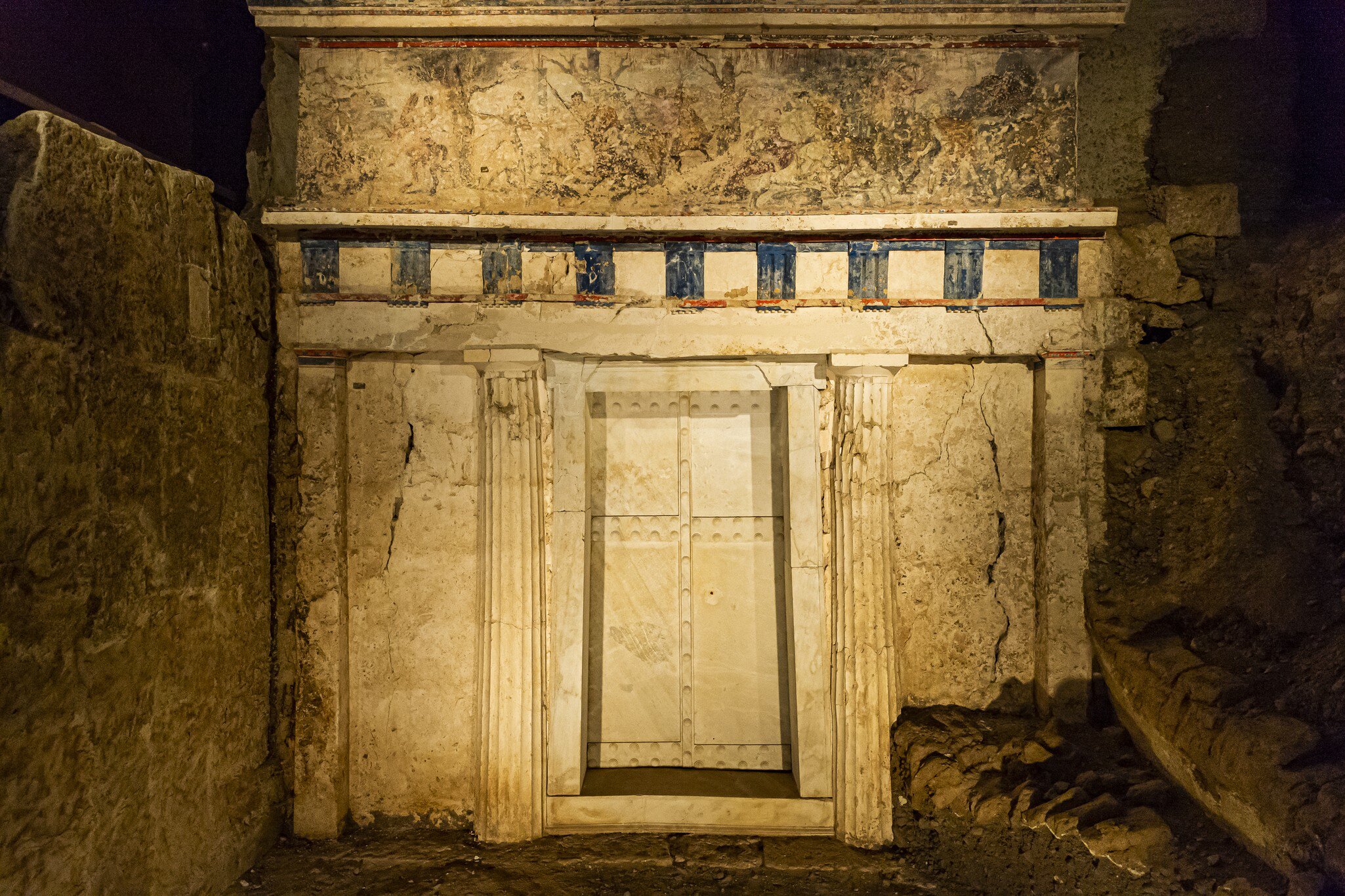 The door to an ancient tomb, decorated by a mural