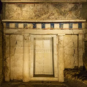 The door to an ancient tomb, decorated by a mural