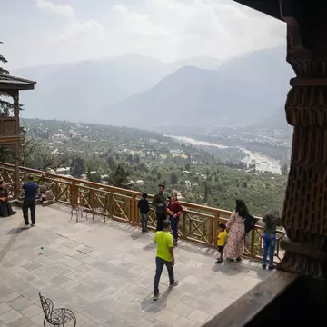 Overview of Kullu Valley from Naggar Castle in bright daylight, with Himalayan hills seen in the background. Himachal Pradesh, India.