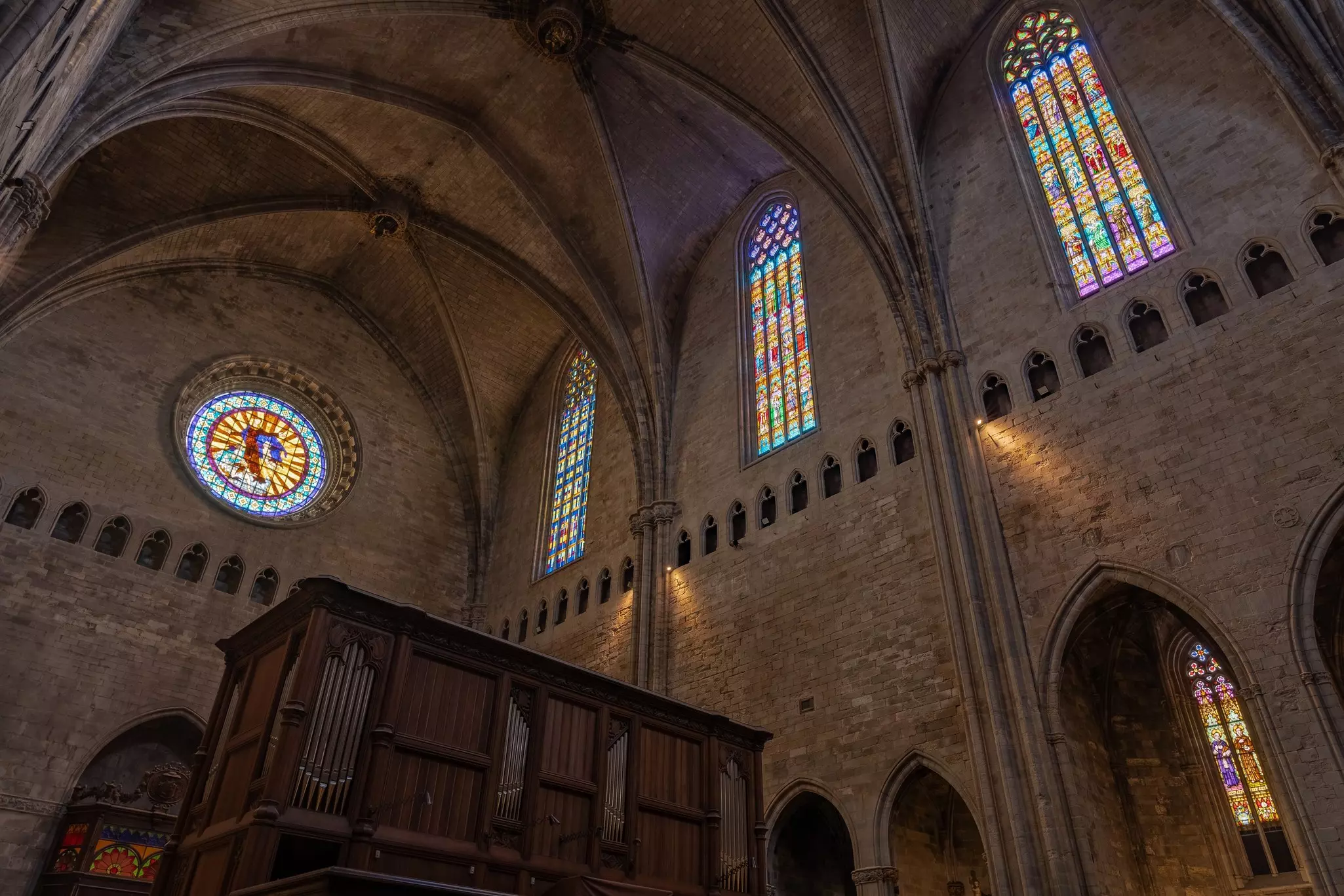 Interior of a church with long, narrow stained glass windows