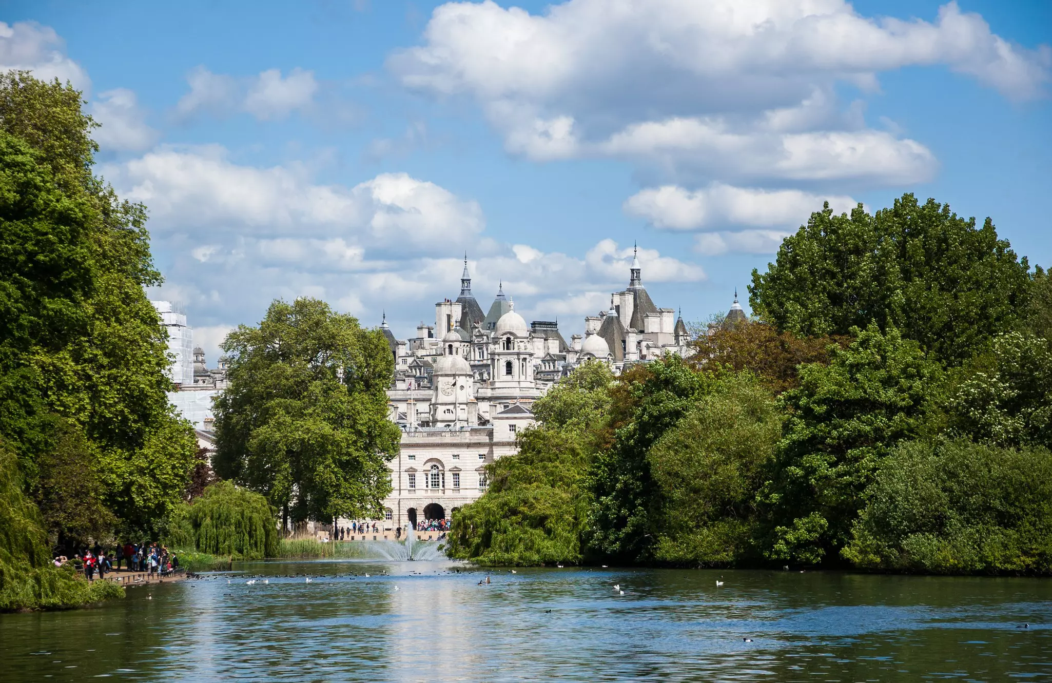 A cityscape view through the Serpentine lake in Hyde Park, Kensington Gardens in sunny day. London UK., License Type: media, Download Time: 2025-01-01T12:55:41.000Z, User: Norma.PrauseBrewer_LonelyPlanet, Editorial: false, purchase_order: 56530 - Guidebooks, job: Global Publishing WIP, client: London 14, other: Norma Brewer