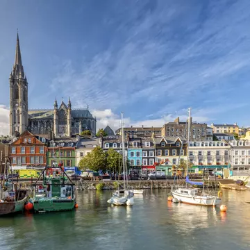 In charming Cobh, you’ll find colorful houses, bright storefronts and the imposing, Gothic-style St Colmans Cathedral. Adobe Stock