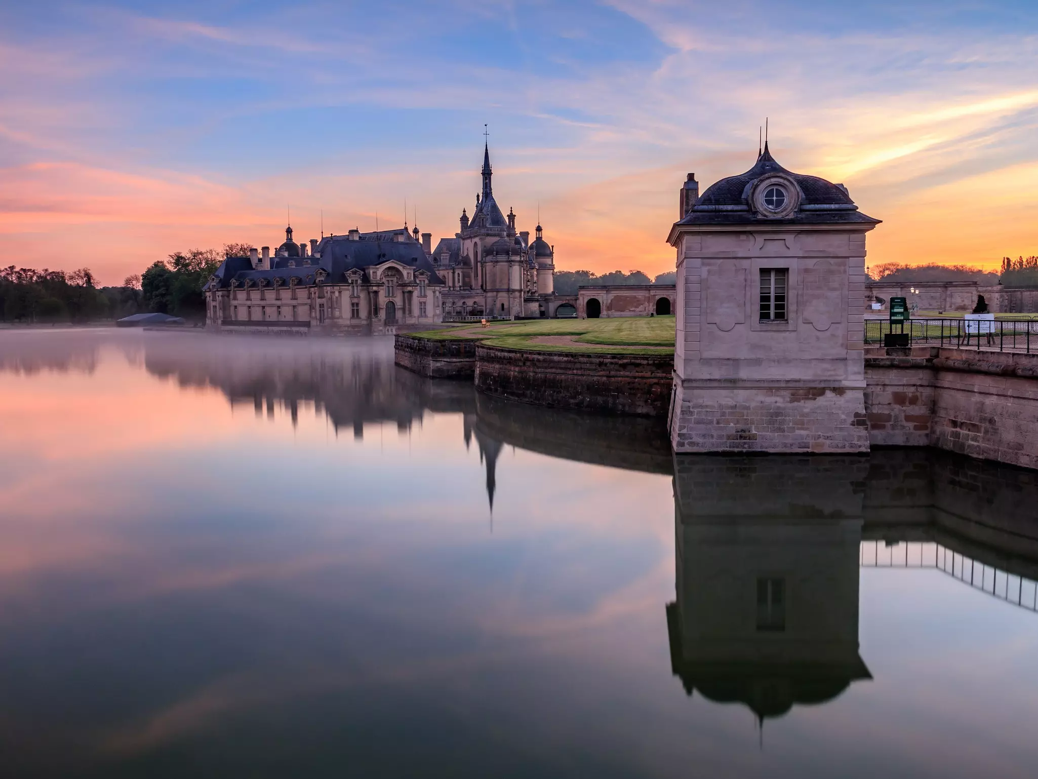 Exterior of the Château de Chantilly during sunrise