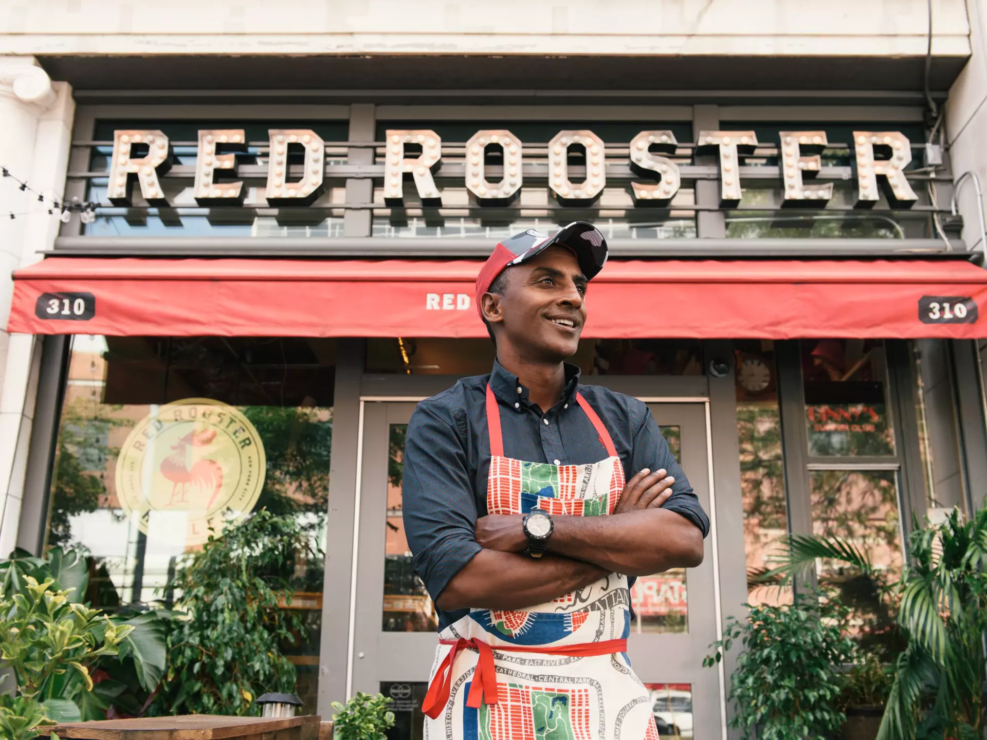 Chef and Harlem denizen Marcus Samuelsson in front of his already-legendary Harlem restaurant Red Rooster © courtesy Red Rooster