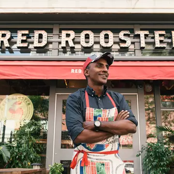 Chef and Harlem denizen Marcus Samuelsson in front of his already-legendary Harlem restaurant Red Rooster © courtesy Red Rooster