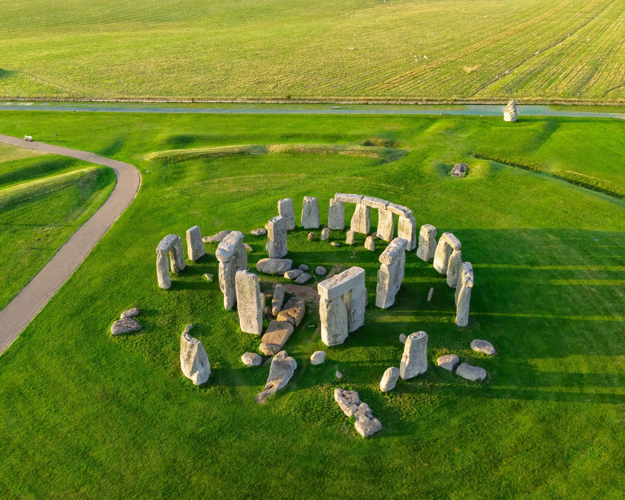 Aerial view of large stone tablets arranged in a circle.